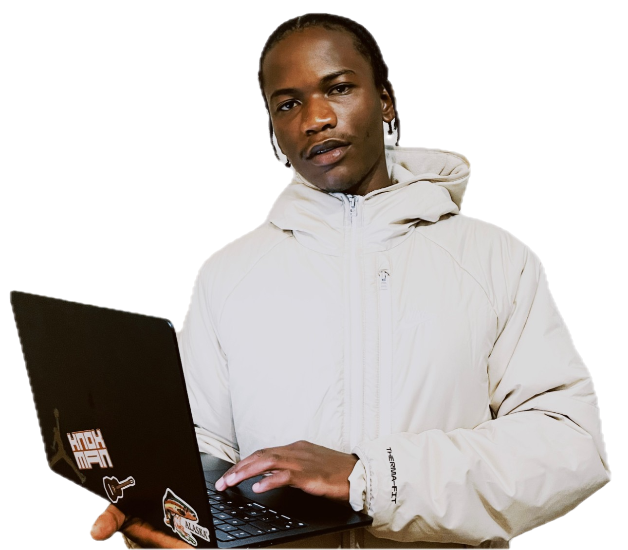 Junya, founder of junyamade, holding a laptop